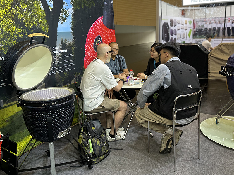 Kamado grill booth with buyer meeting